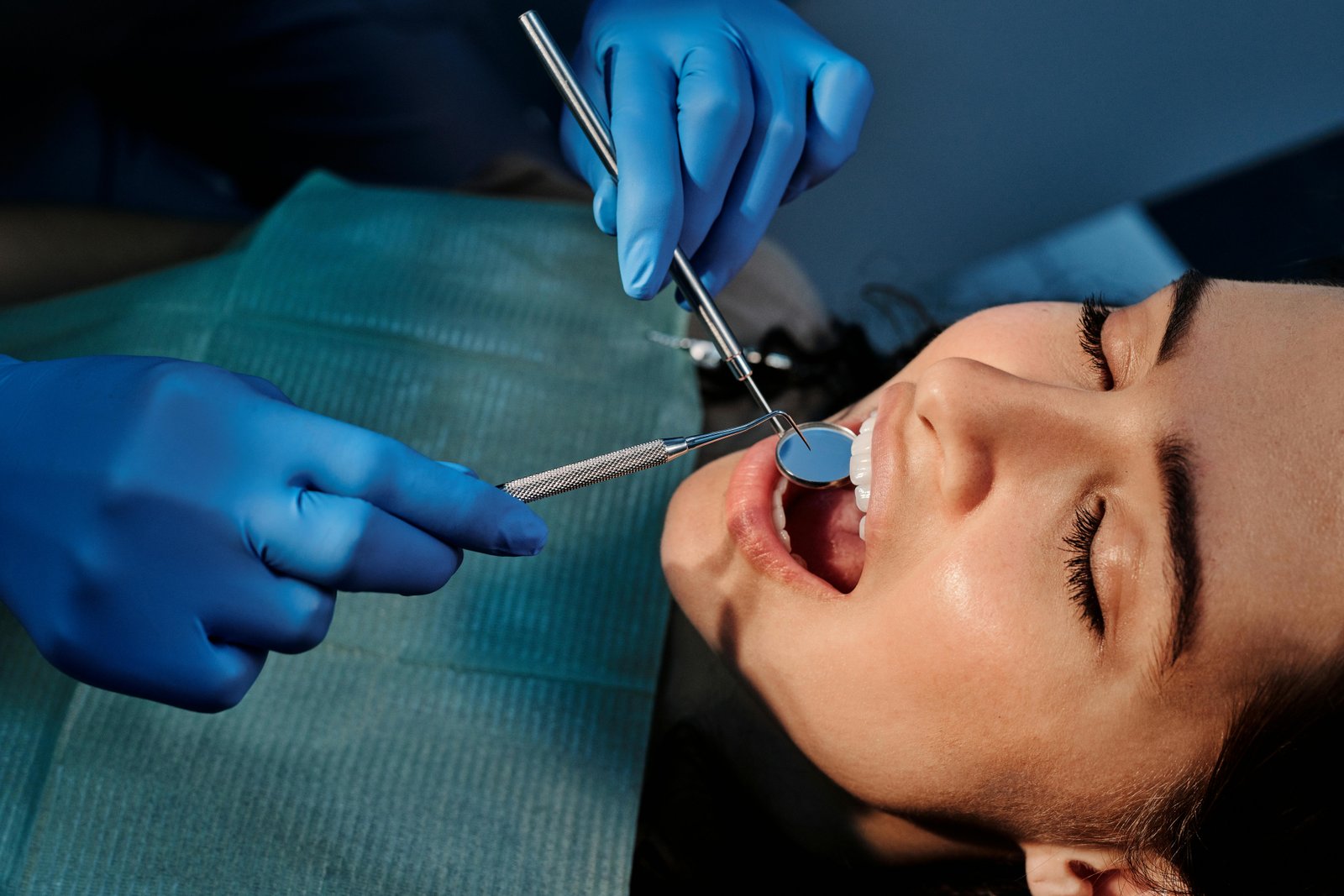 Dental hygienist performing a check-up and cleaning